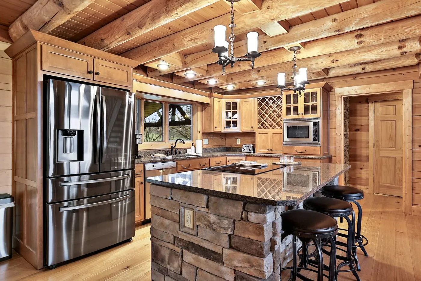 Kitchen with stainless refrigerator