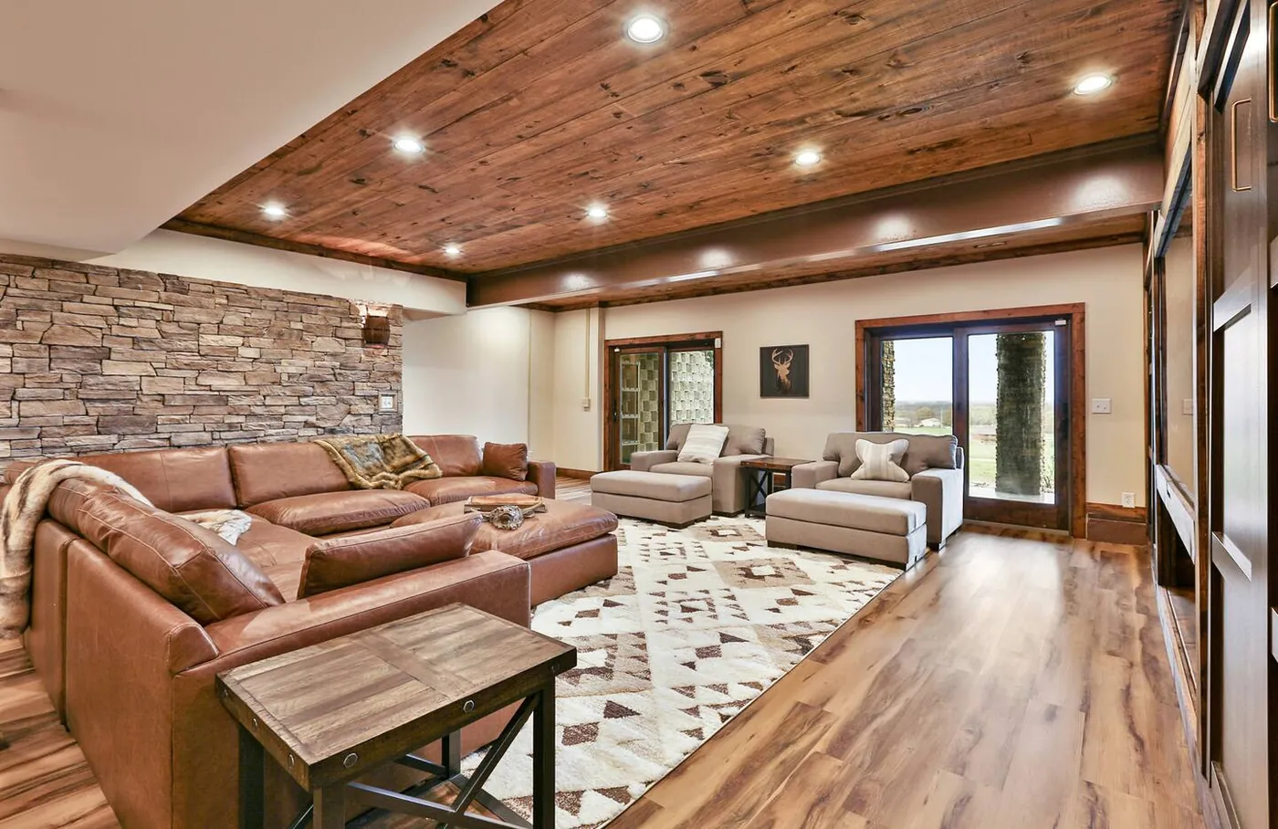 Lower-level living room with stone accent wall